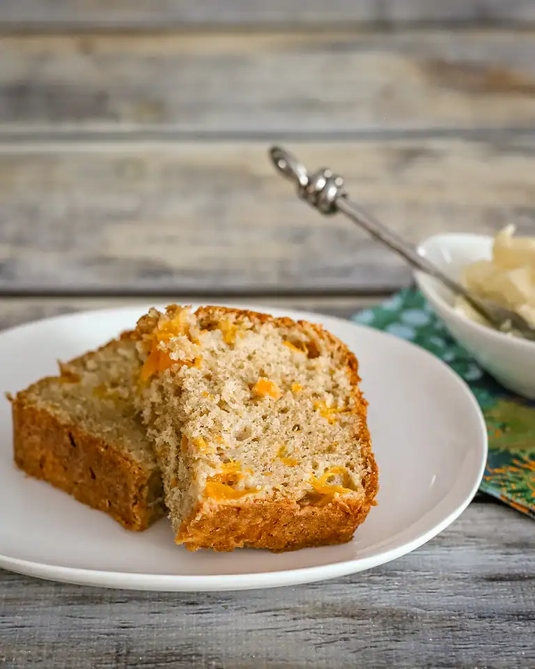 Sweet banana bread with chunks of orange zest.