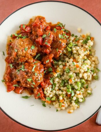moroccan meatballs on a plate with couscous