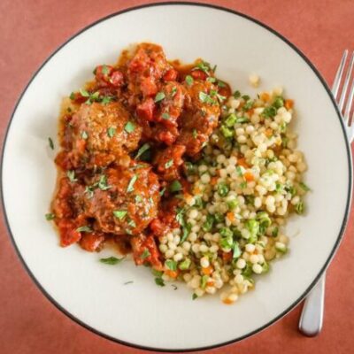 moroccan meatballs on a plate with couscous