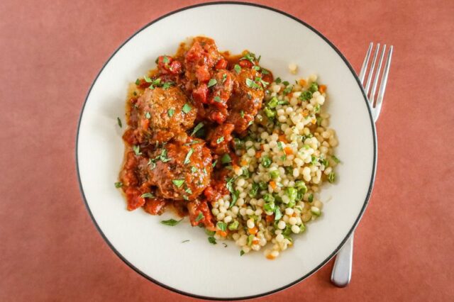 moroccan meatballs on a plate with couscous