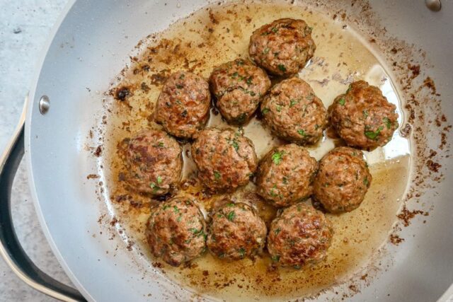 Frying the Moroccan meatballs.
