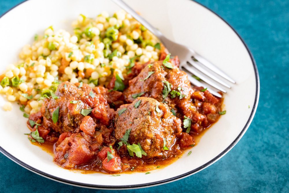 Moroccan meatballs in a bowl with couscous
