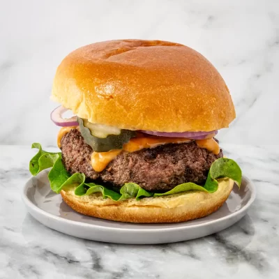 Juicy beef burger with fresh vegetables and melted cheese.