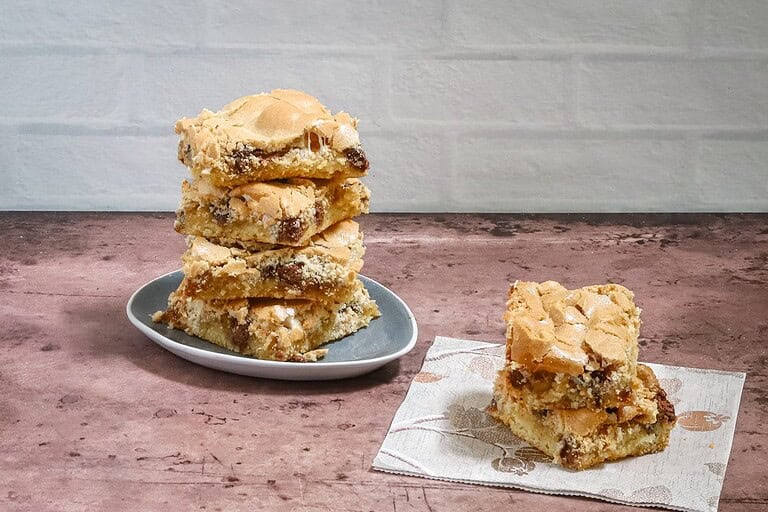 Dense cookie bars with chocolate chips and nuts.