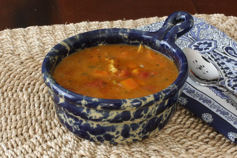 A bowl of lentil and chicken Mulligatawny soup.