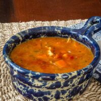 Mulligatawny soup with lentils, vegetables, curry powder, and coconut milk.