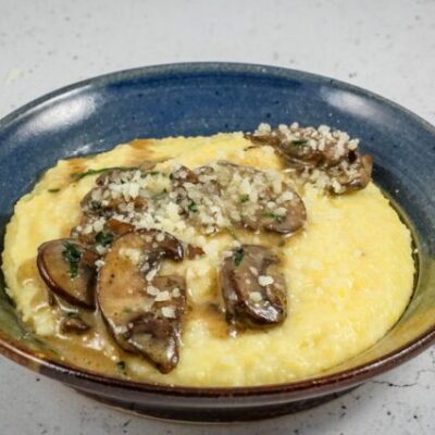 Sautéed mushrooms with butter and white wine over polenta.