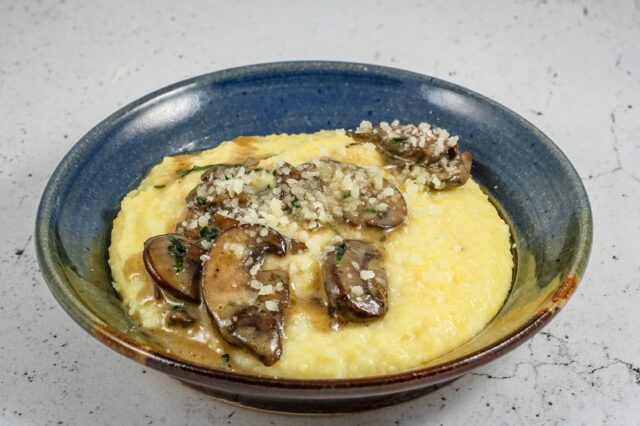 Sautéed mushrooms with butter and white wine over polenta.