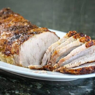 sweet mustard glazed pork loin on a platter.