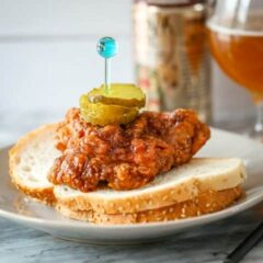 Nashville hot chicken on bread with pickles and beer