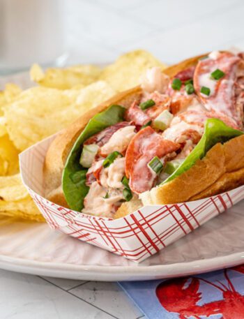 An authentic New England lobster roll in a New England hot dog roll.