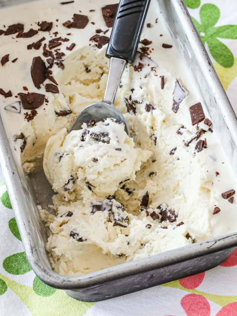 Easy no churn ice cream in a loaf pan with scoop.