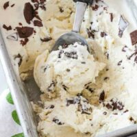 Easy no churn ice cream with a scoop in a loaf pan.