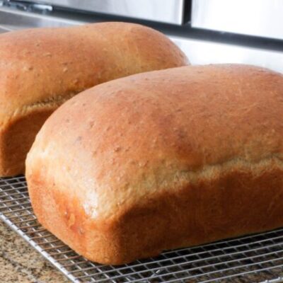 Loaves of oatmeal molasses bread.
