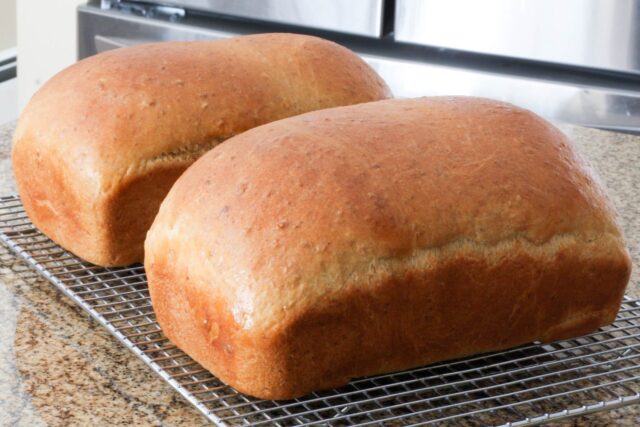 Loaves of oatmeal molasses bread.