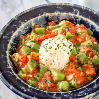 okra and tomatoes with a mound of rice