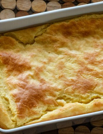 A baking dish with old-fashioned spoonbread, baked