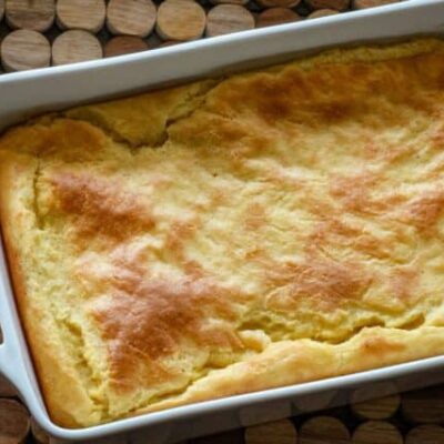 A baking dish with old-fashioned spoonbread, baked