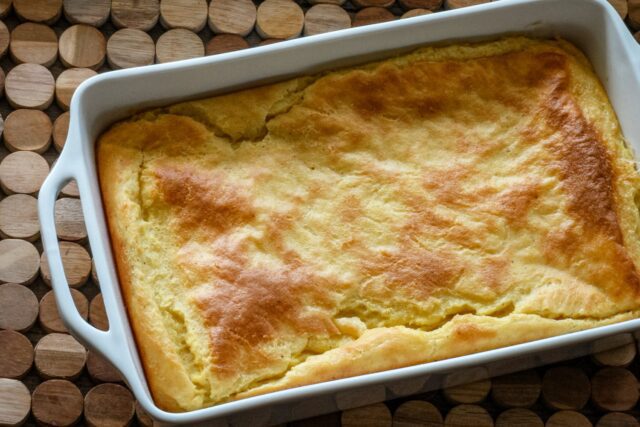 A baking dish with old-fashioned spoonbread, baked