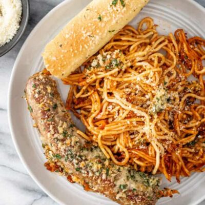 A plate of crispy one pot spaghetti and sausage dinner.