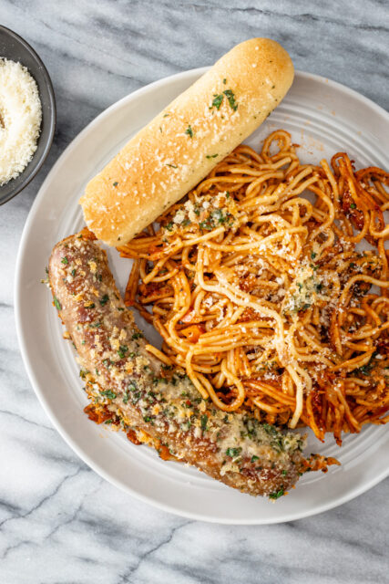 A plate of crispy one pot spaghetti and sausage dinner.