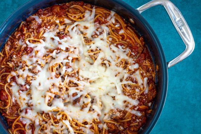 One pot spaghetti dinner with a mozzarella cheese topping.