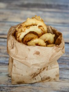 onion rings in a paper bag