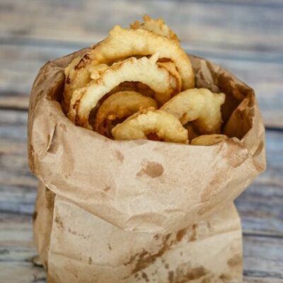 onion rings in a paper bag