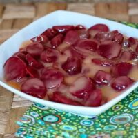 orange glazed beets in a serving bowl