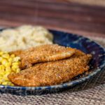 spiced oven-fried chicken breasts on a plate