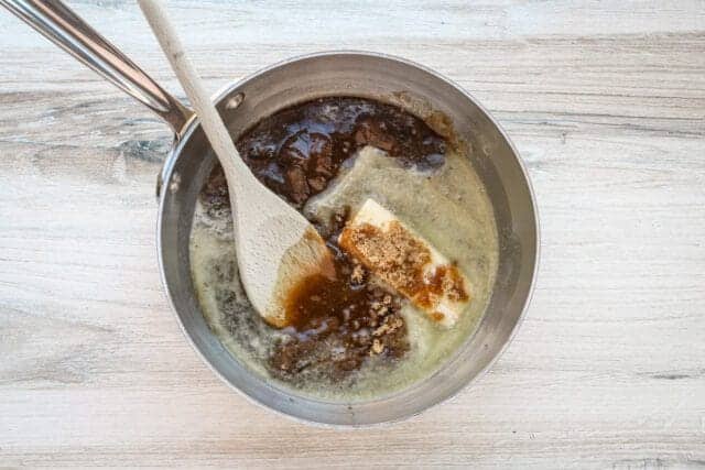 Cream and spices melting in a saucepan for cooking.