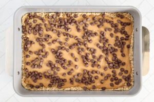 Chocolate chips added to the peanut butter layer