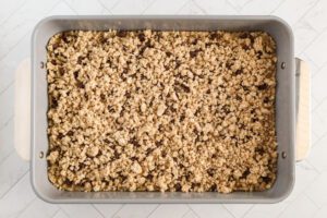 Remaining crumbs sprinkled over the bar mixture.