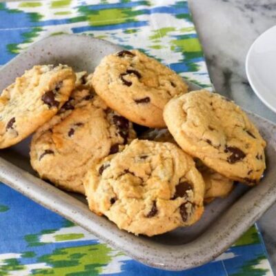 A small tray with baked peanut butter chocolate chip cookies.