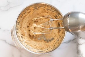 Making the batter for peanut butter crackles.