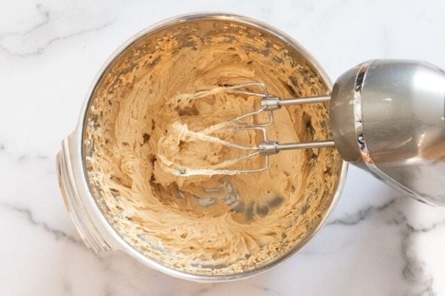 Making the batter for peanut butter crackles.