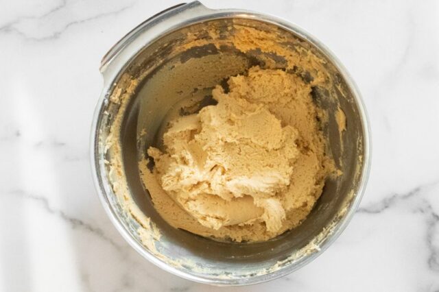 Making the batter for peanut butter crackles.