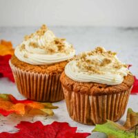 Peanut butter cupcakes, frosted with cookie crumbs garnish.