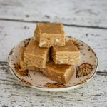 A stack of peanut butter fudge cut into squares