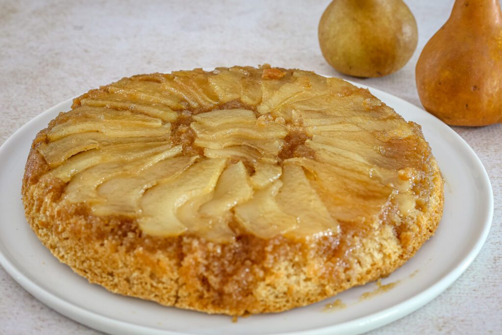 pear upside down cake on a cake platter