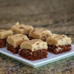 brownies with penuche frosting on a plate