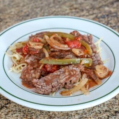 pepper steak strips with tomatoes, onions, and bell peppers.