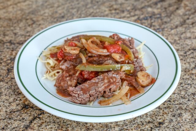 pepper steak strips with tomatoes, onions, and bell peppers.