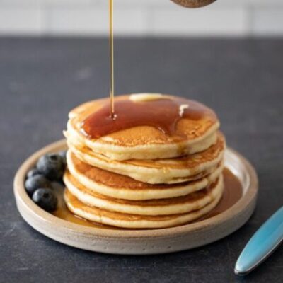 pancakes on a plate with maple syrup