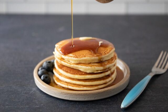 pancakes on a plate with maple syrup