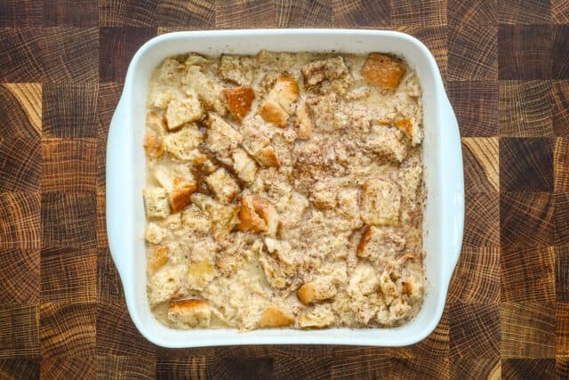 A baking dish with French toast casserole, ready to go into the oven.