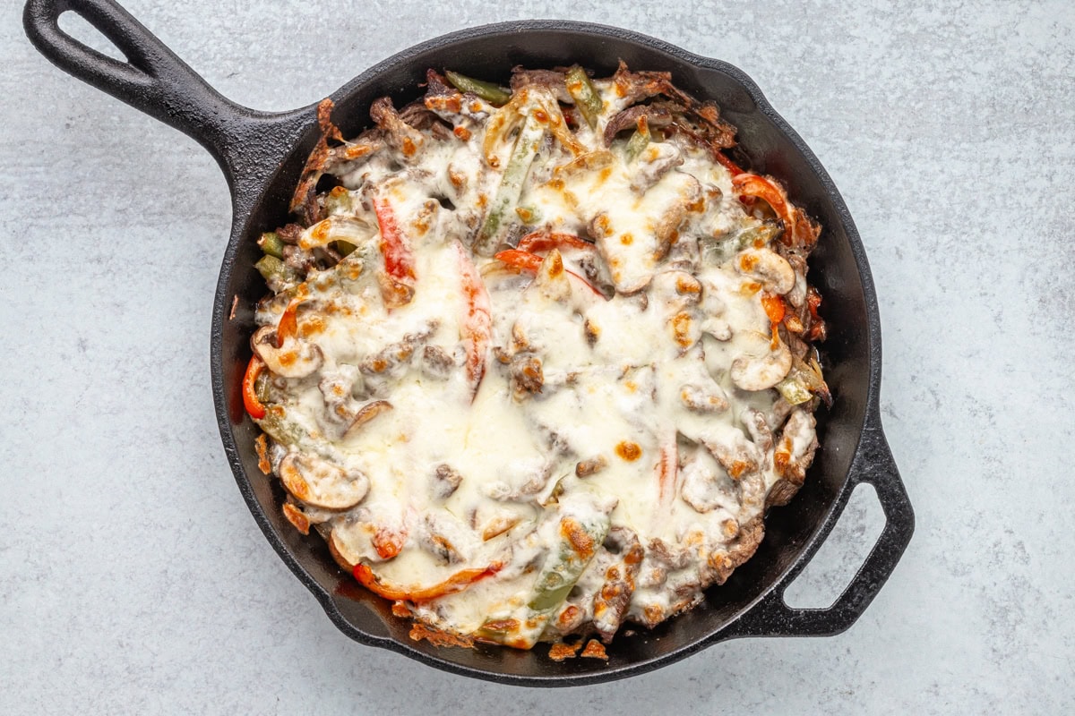 A skillet with Philly cheesesteak fixings to be enjoyed with or without the rolls or buns.