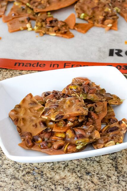 broken pistachio brittle in a serving dish