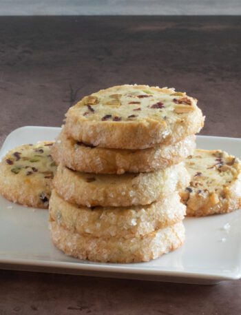 A stack of pistachio cranberry shortbread cookies