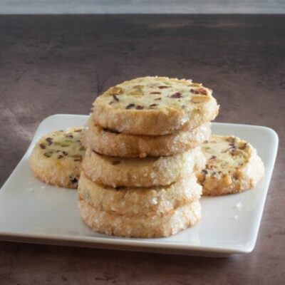 A stack of pistachio cranberry shortbread cookies